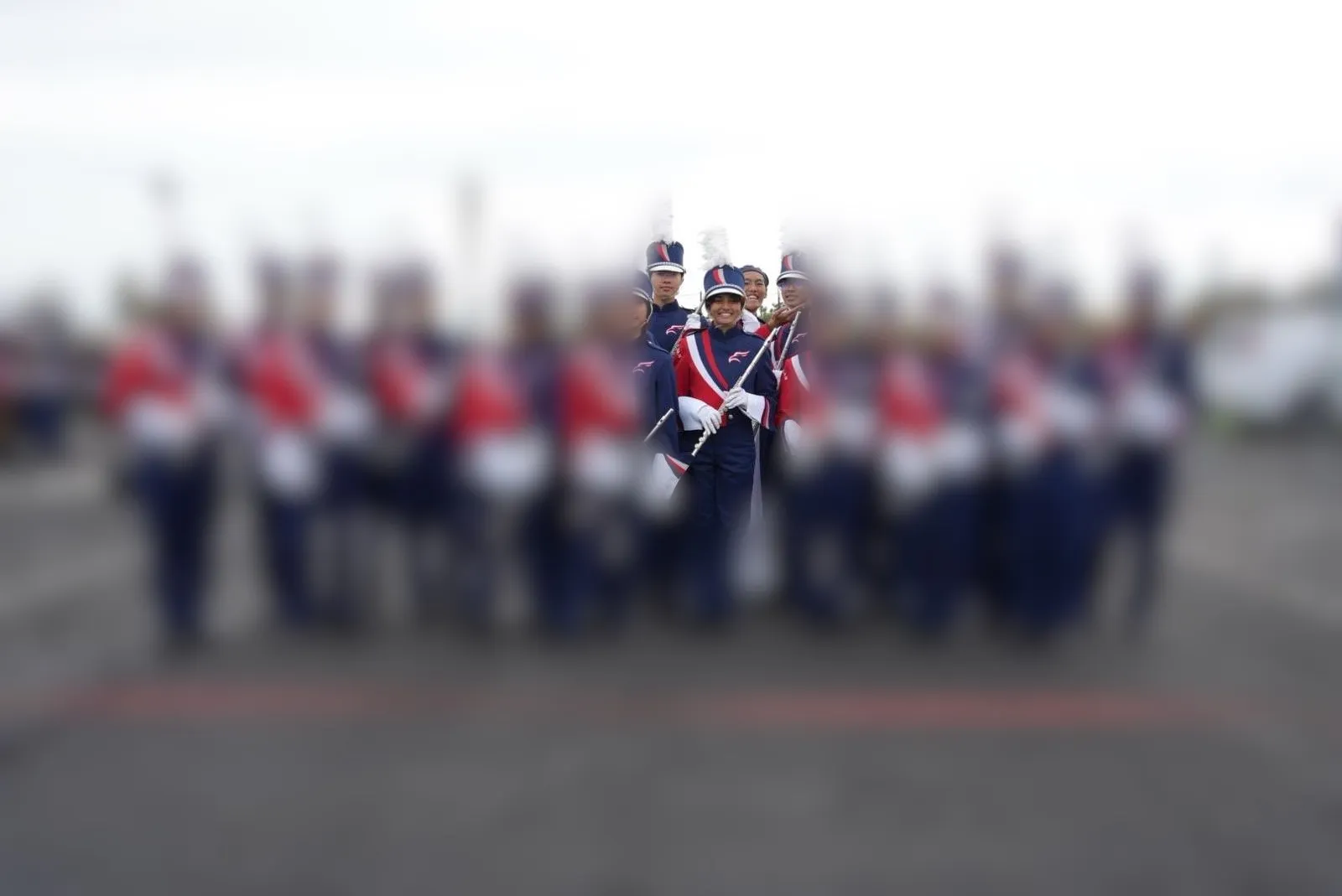 The flute section in uniform before a performance, with Isha at the centre.